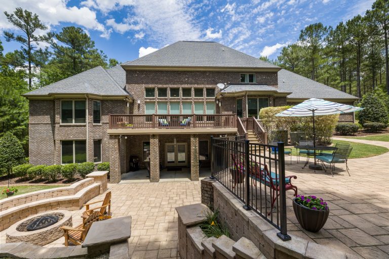 Outdoor living space with patio fire pit and retaining wall in Virginia