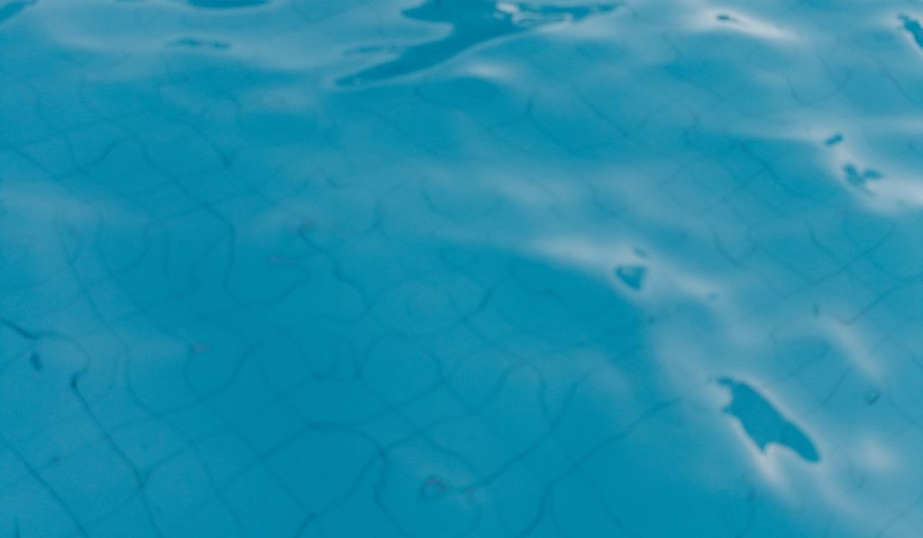 Balanced blue pool water maintained with quality pool chemicals